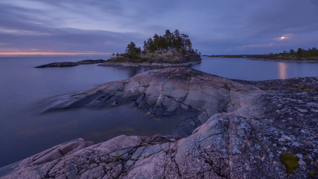 The rocky shore of Lake Ladoga seen in the low morning light.